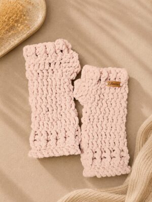 Handmade crochet fingerless gloves in soft blush pink with a textured stitch pattern