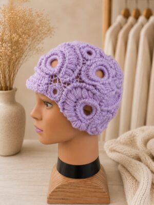 Handmade lavender crochet hat featuring Irish lace-inspired circular motifs and textured floral detailing.